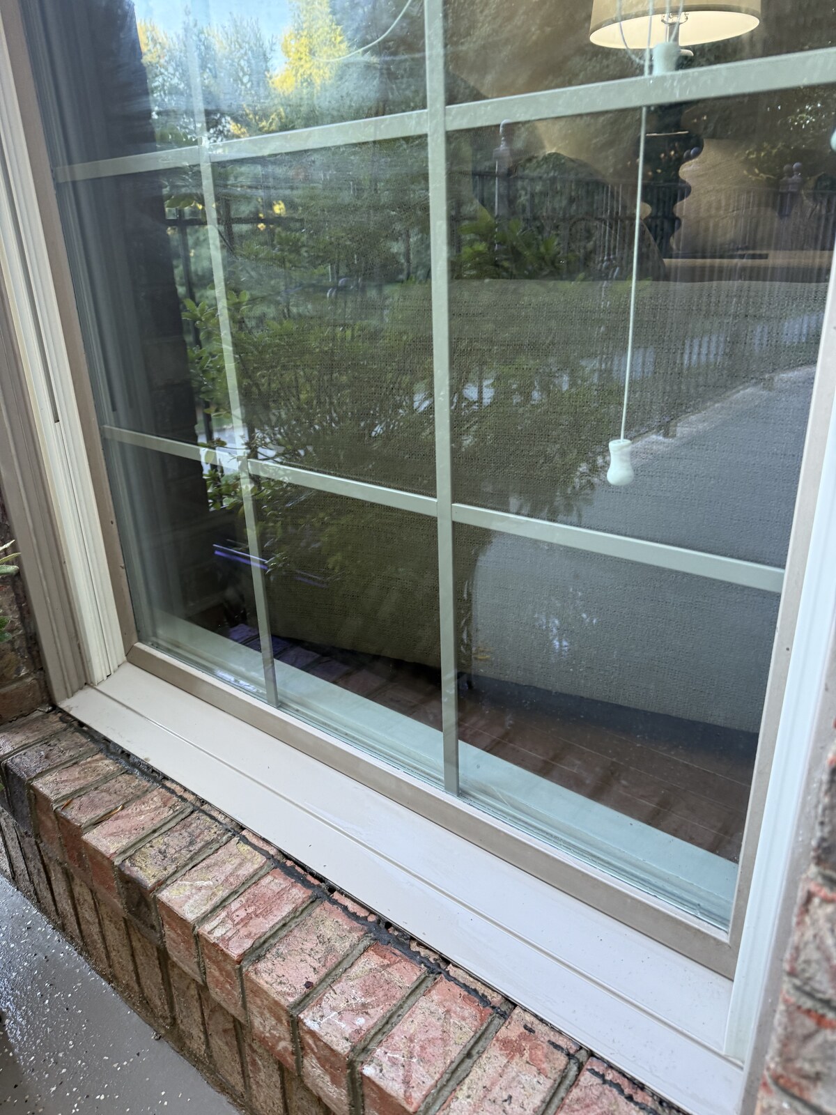 The same window sill and frame scrubbed clean after cleaning